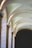 Elegant arches with soft natural lighting create a serene and timeless atmosphere. The stone structure features smooth, curved lines that enhance the architectural beauty of the space.