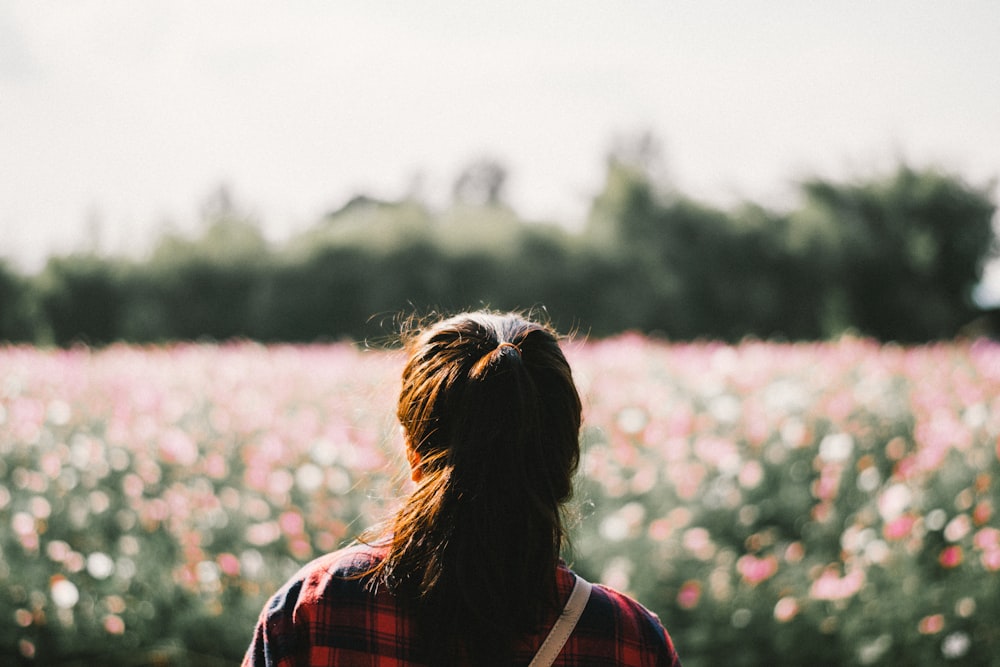 woman standing in front of garden