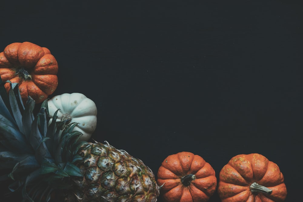 close-up photo of pineapple and pumpkin