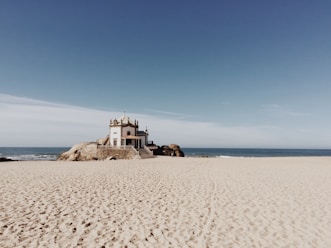 white concrete castle on beach
