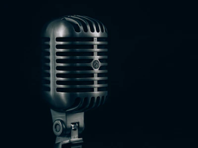 Elegant golden microphone on a black background symbolizing premium radio advertising.