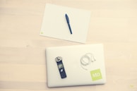 A serene workspace with medical reference books and a laptop ready for transcription.