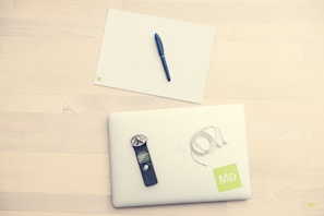 A professional setup of notarization materials including seals, certificates, and a laptop.