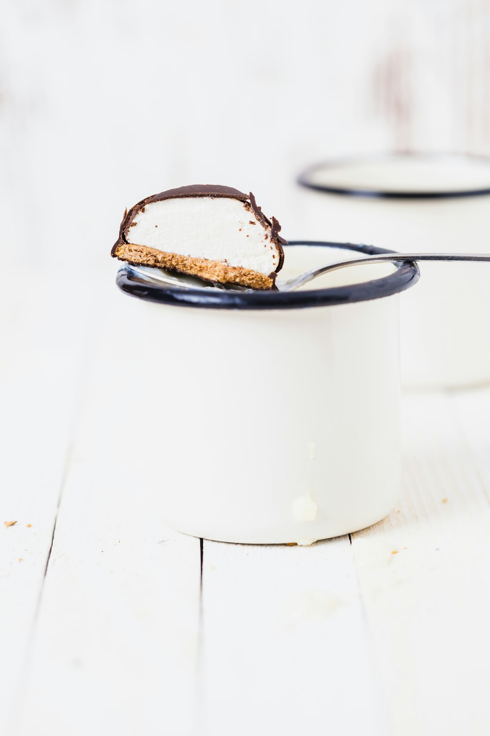 chocolate biscuit in white mug