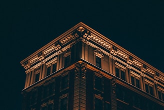 worm's-eye view of building during nighttime