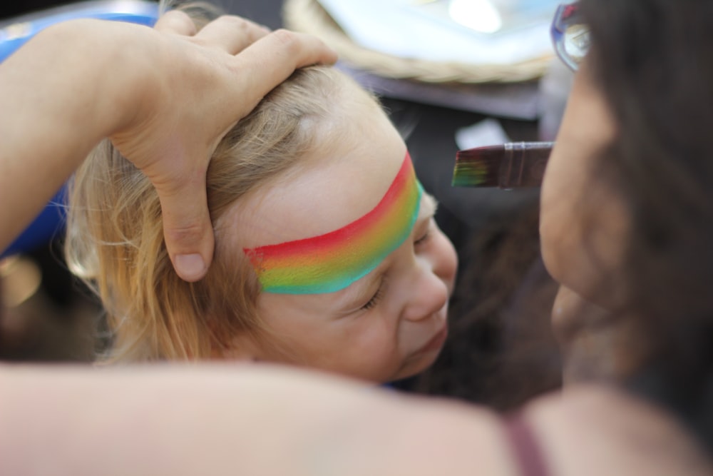 woman stroking child's hair