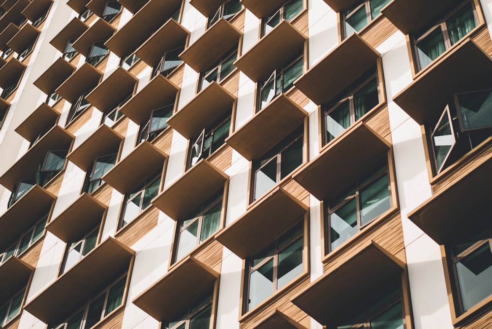 white and brown concrete apartment building during daytime