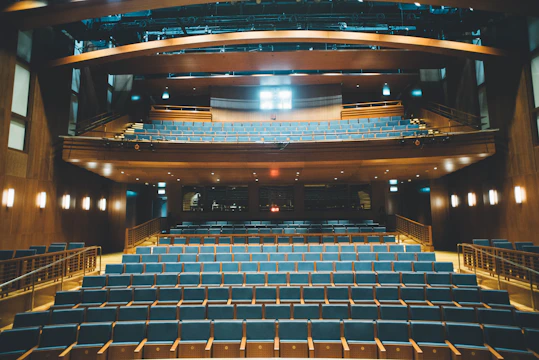 Spacious auditorium with stylish seating and acoustic wall treatments.