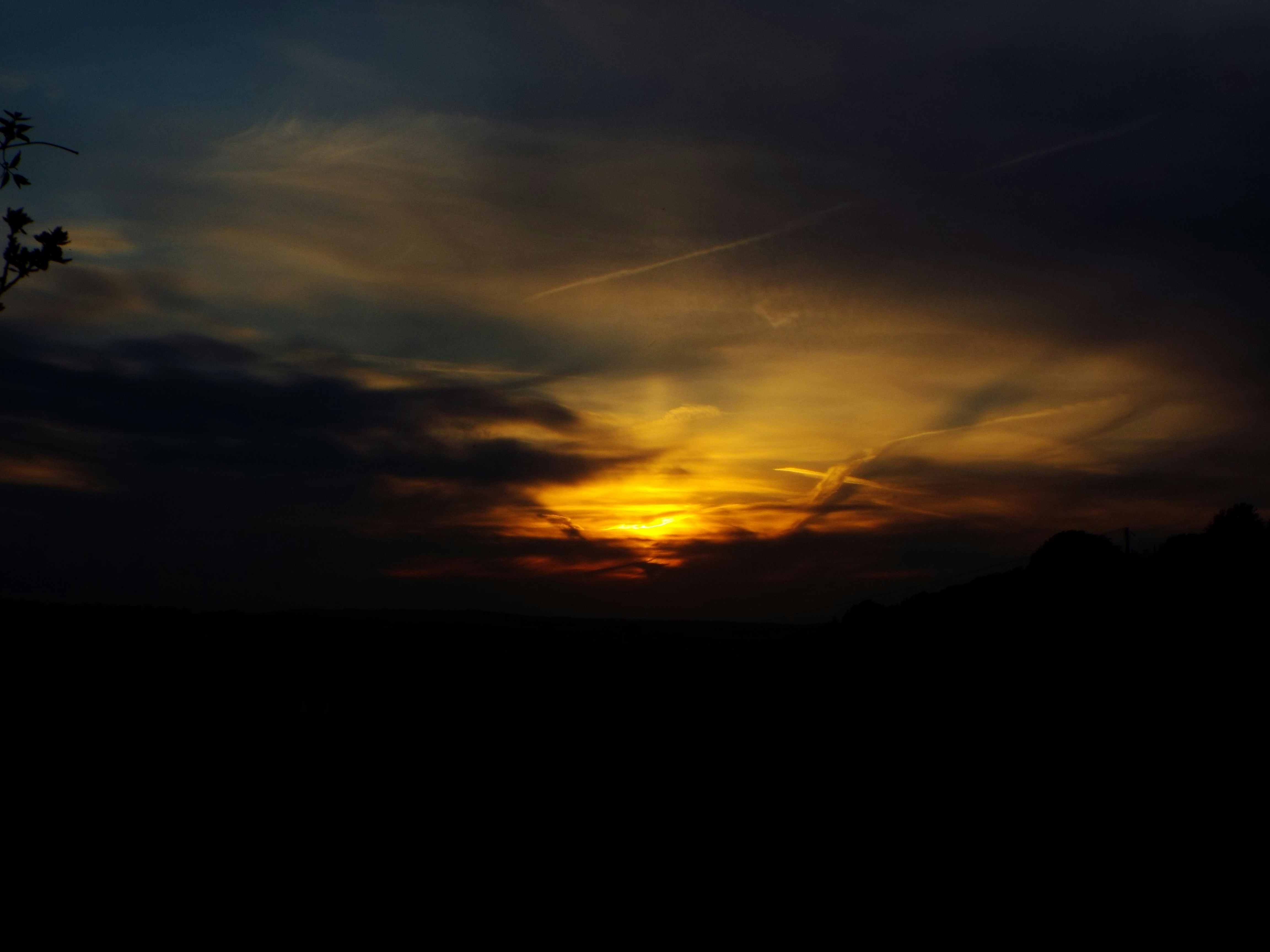 Sunset In Dark Clouds