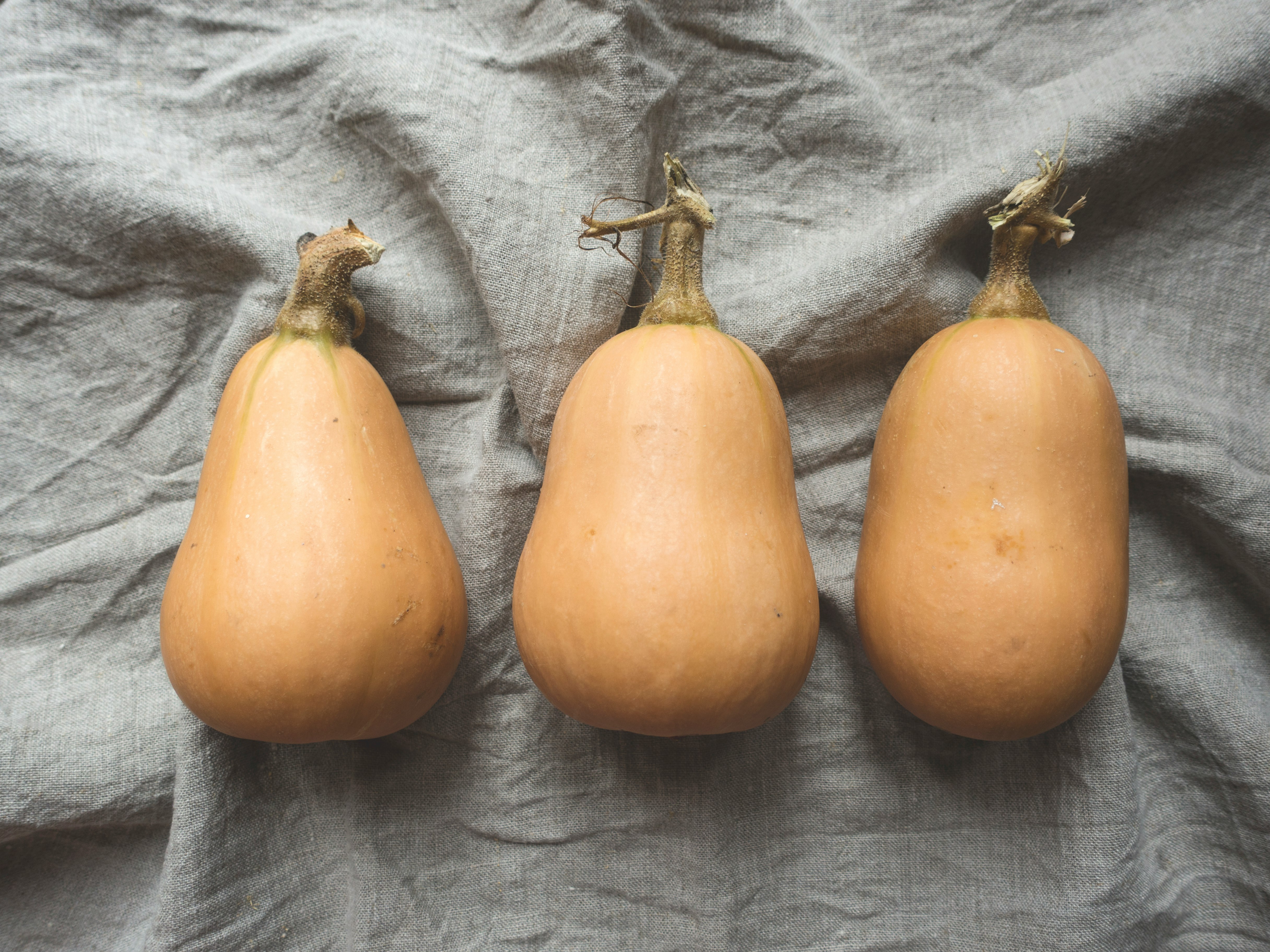 three orange pumpkins