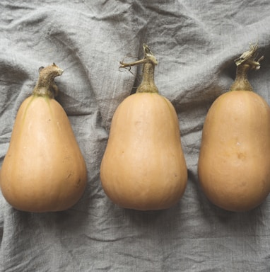 three orange pumpkins