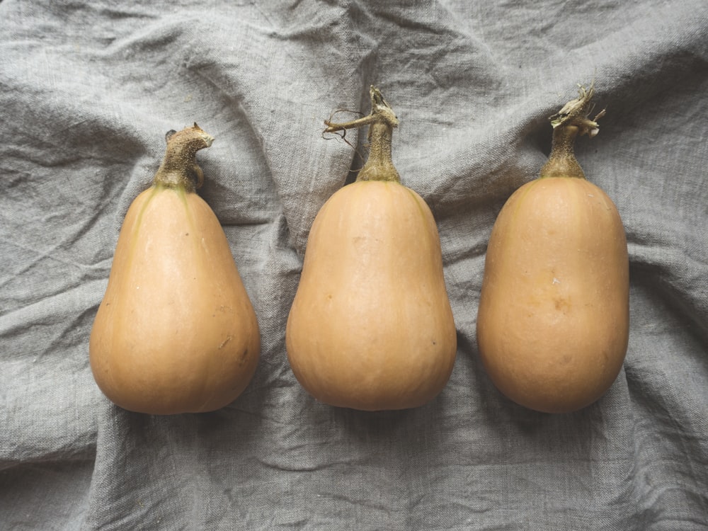 three orange pumpkins