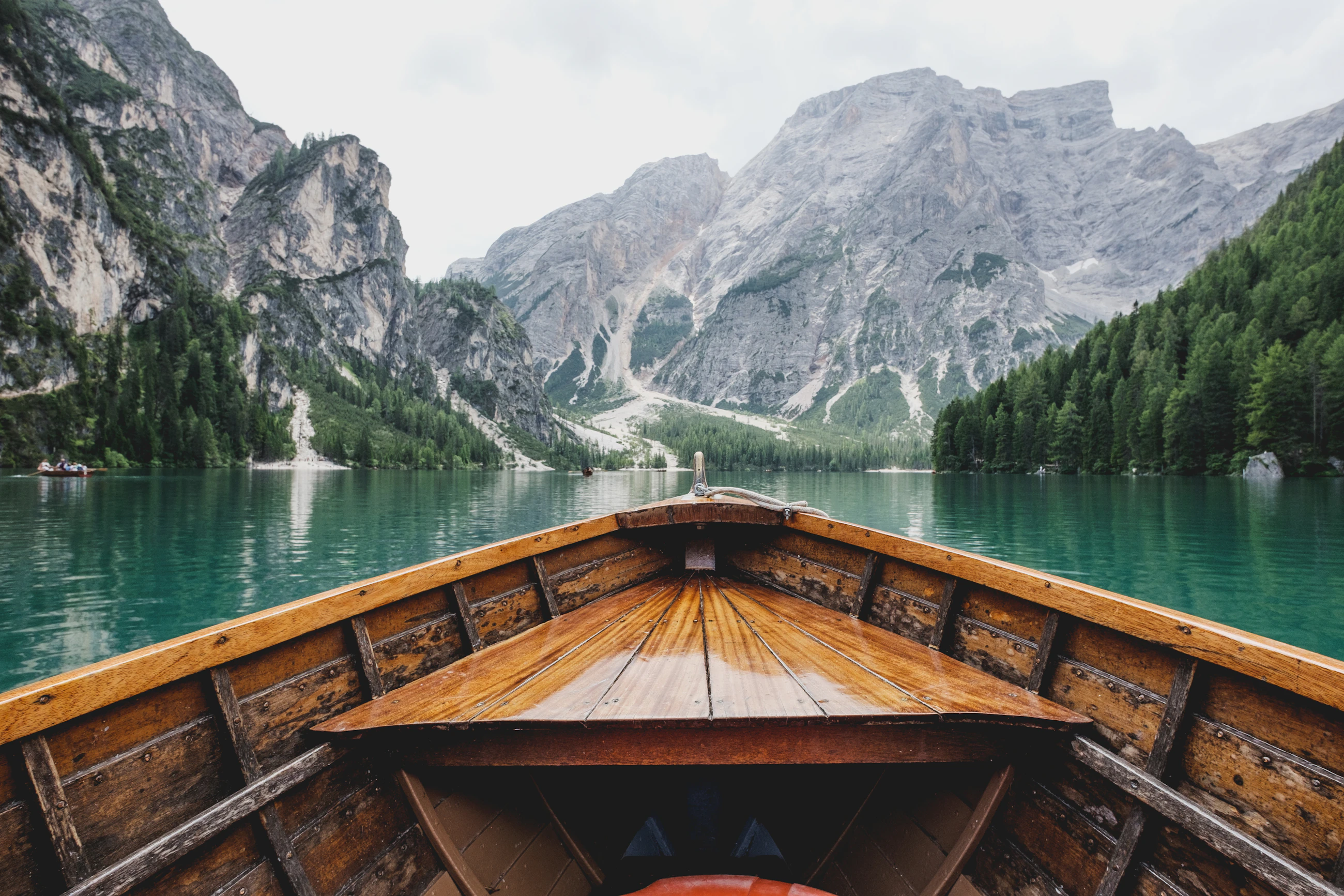 A canoe on a still turquoise mountain lake in the Canadian Rockies