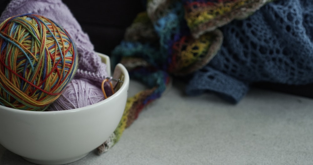 yarn balls on white bowl
