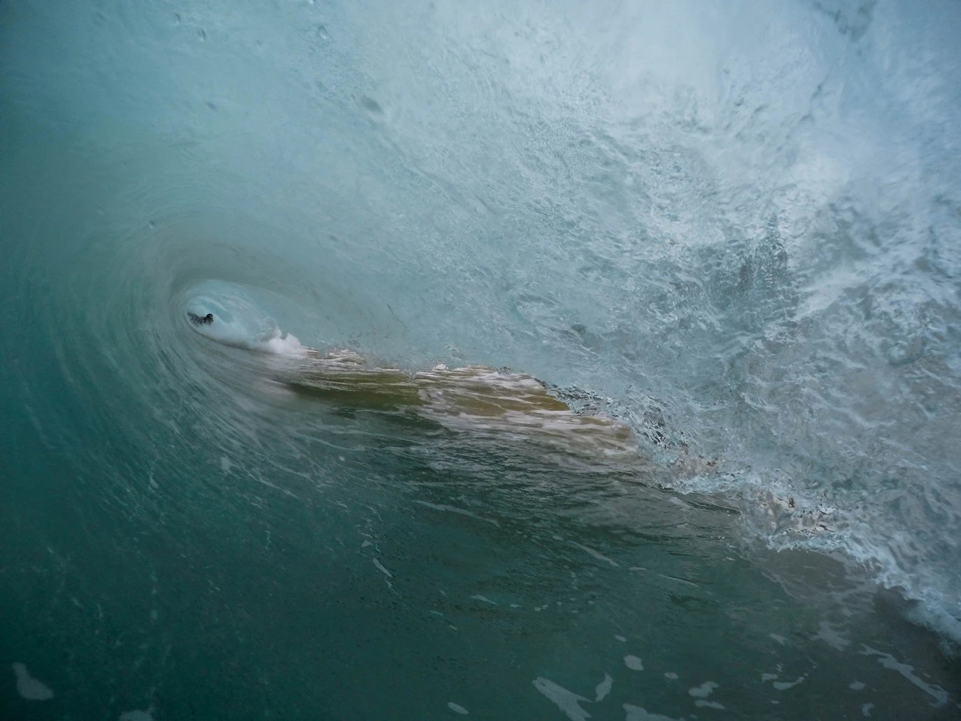 Shorebreak in the barrel view, Jeremy Bishop on Unsplash