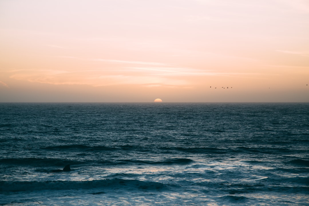 Ocean view towards the pale yellow horizon