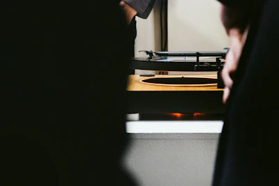 Detailed view of the turntable's Bluetooth connectivity interface glowing softly.