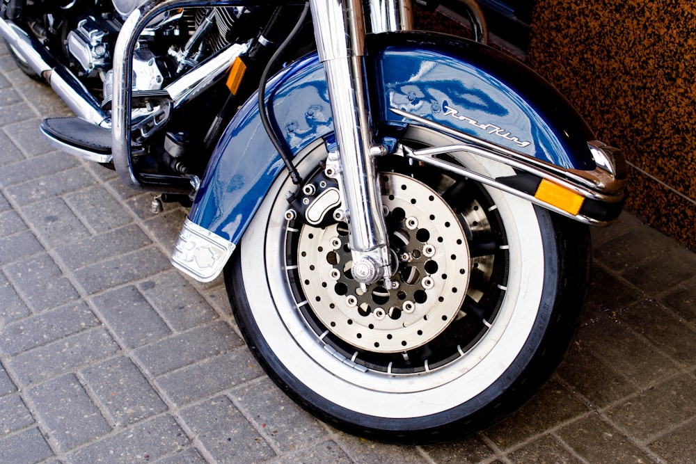 shallow focus photo of blue motorcycle fender