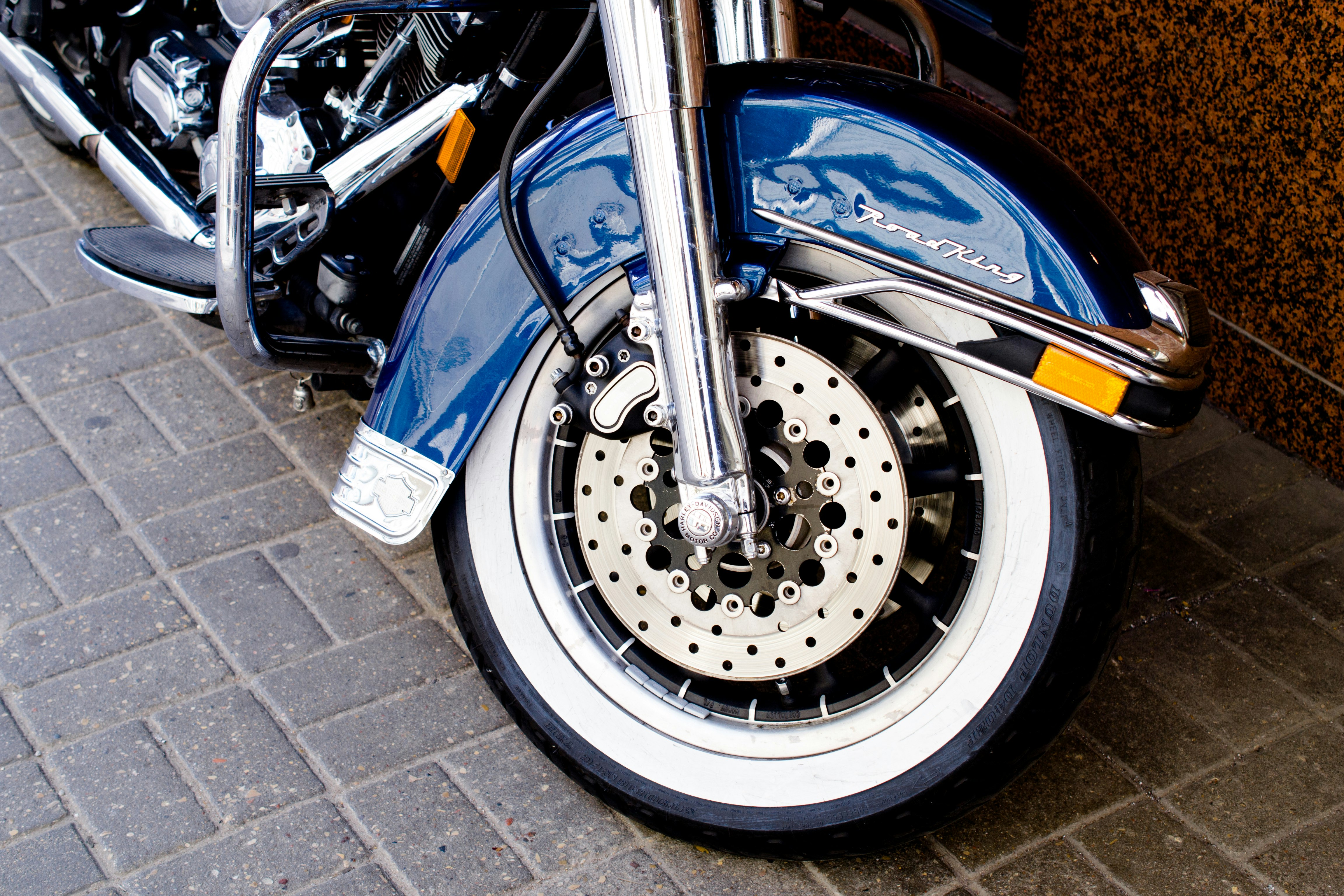 shallow focus photo of blue motorcycle fender