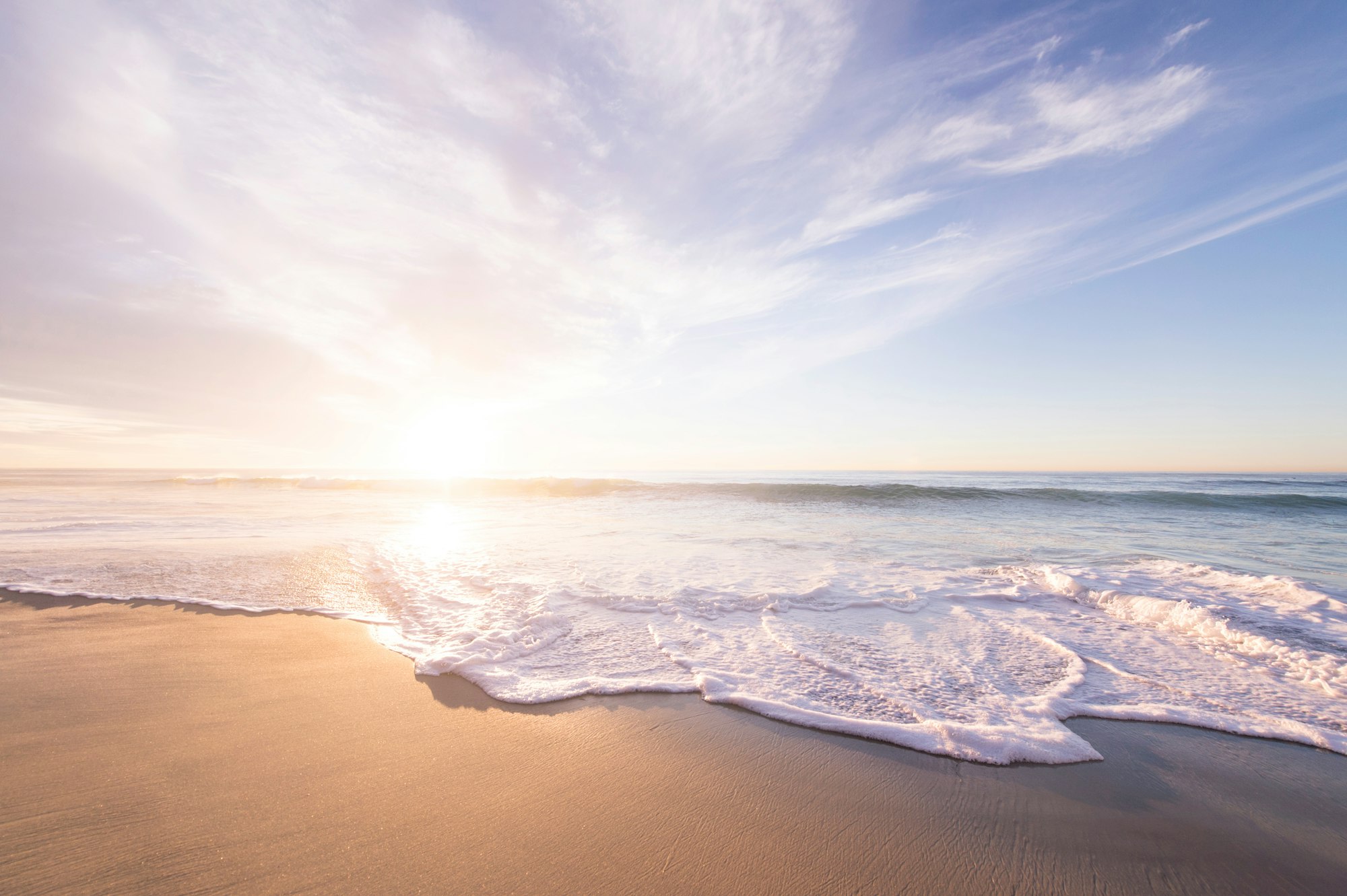 Sunrise above a sandy beach