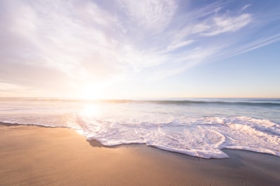 body of water during daytime sea teams background