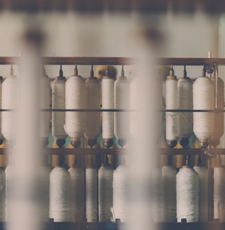 photography of white treadle on brown wooden rack