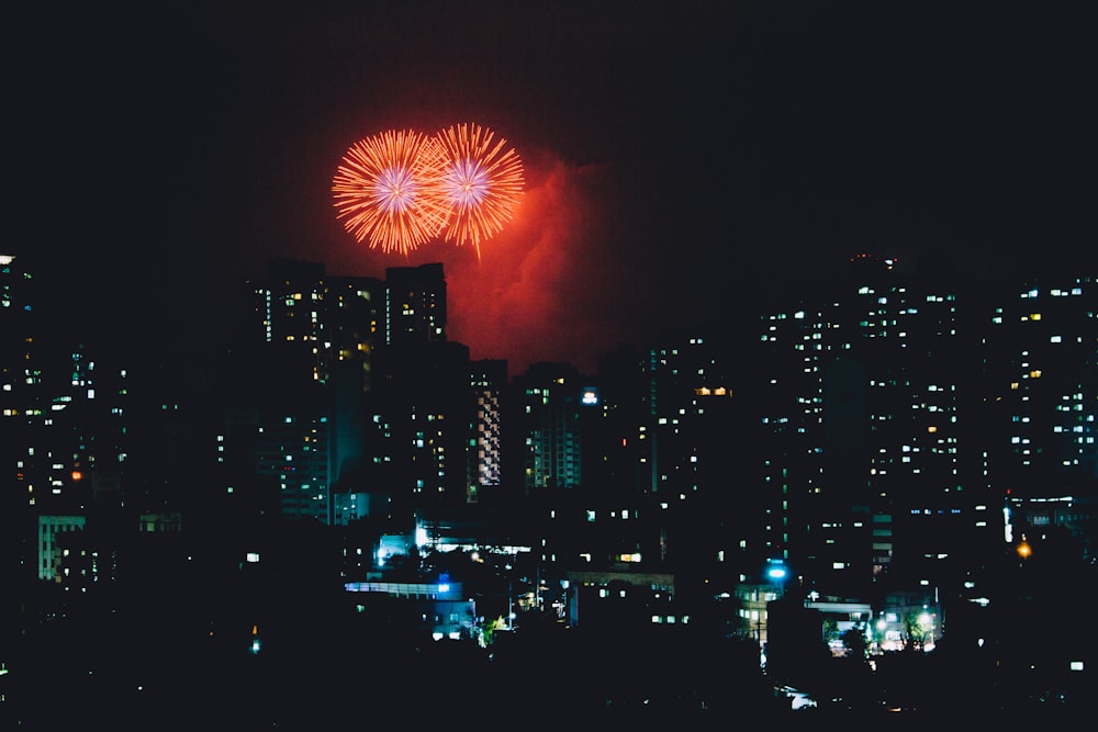 high-rise buildings and fireworks display