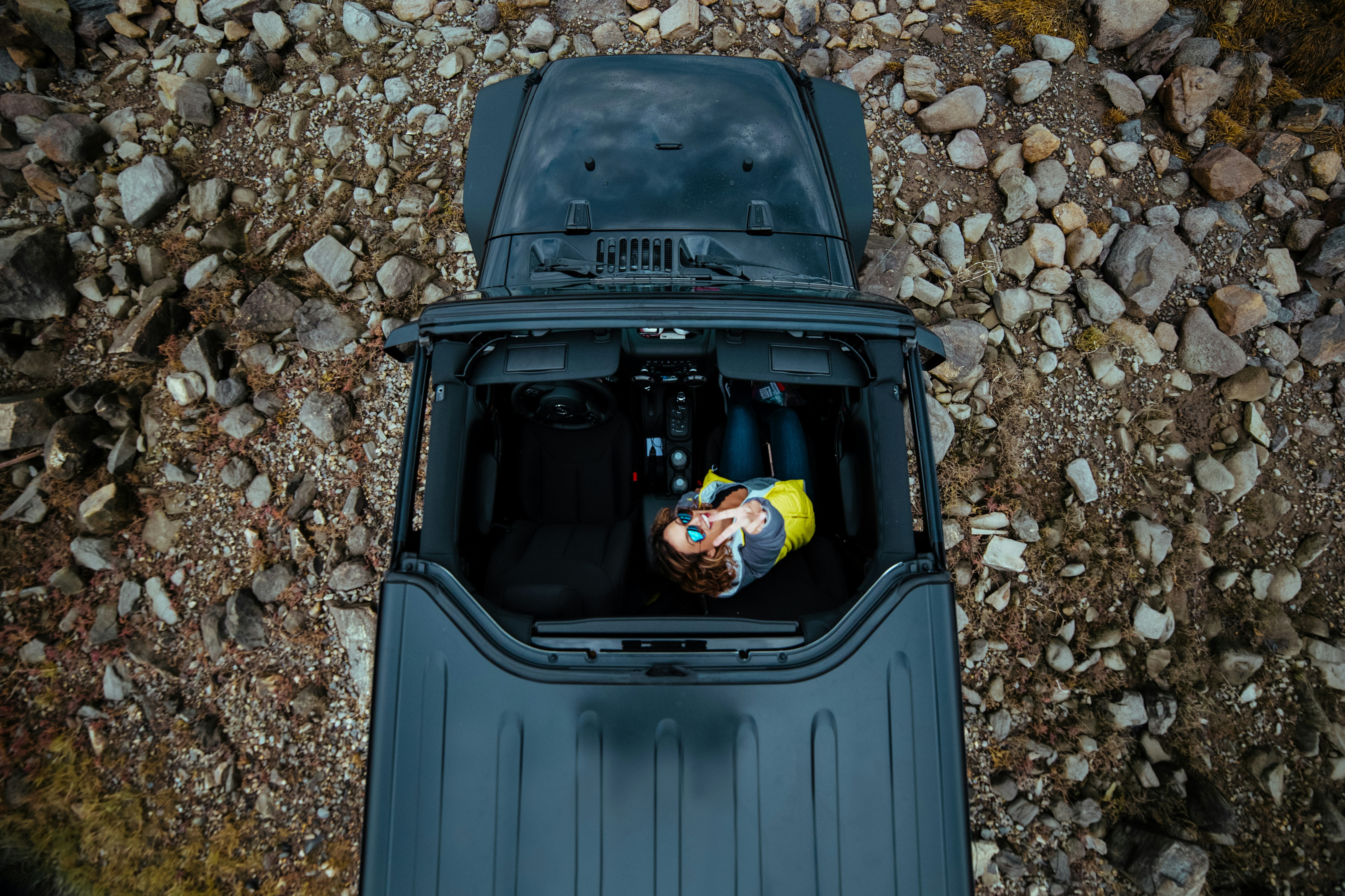 bird's eye view of person riding black top-down vehicle