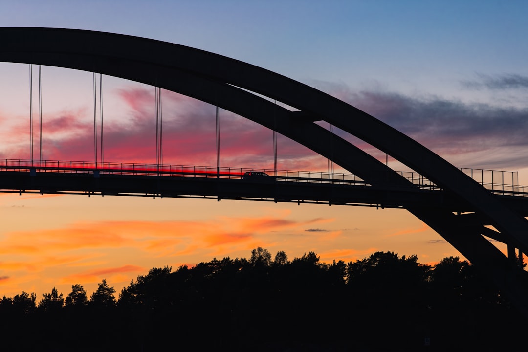 silhouette of suspension bridge during sunset, Silhouette of the Djuröbron suspension bridge