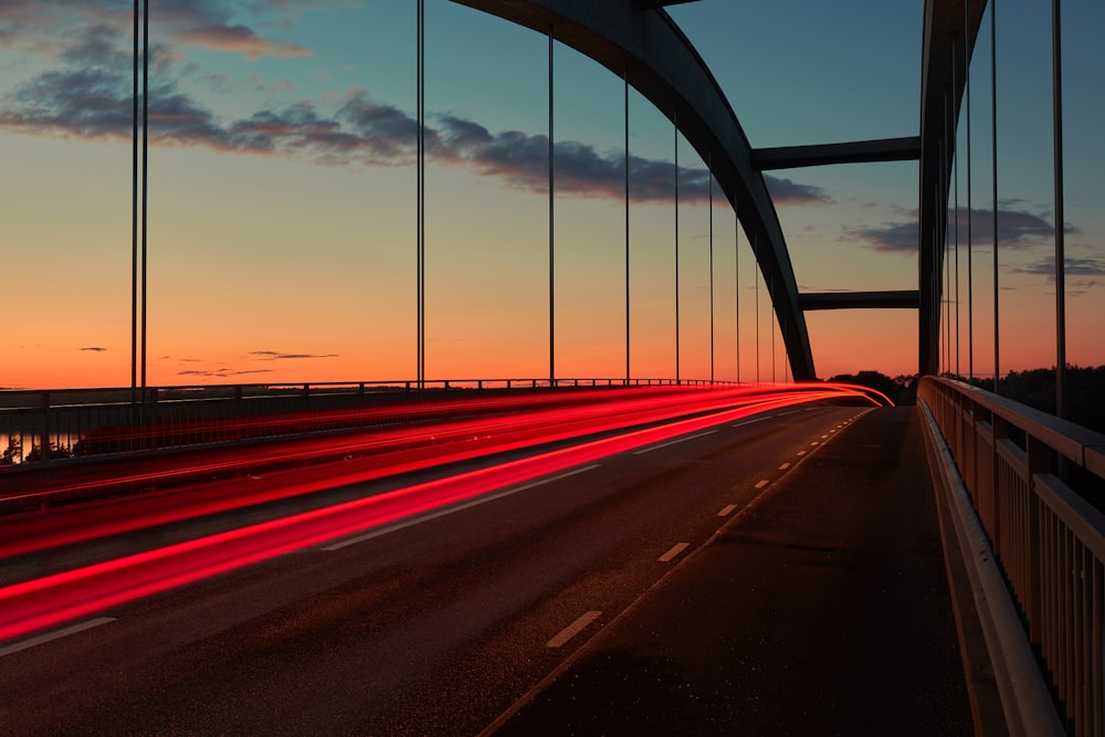 time lapse photo of cable bridge during golden hour