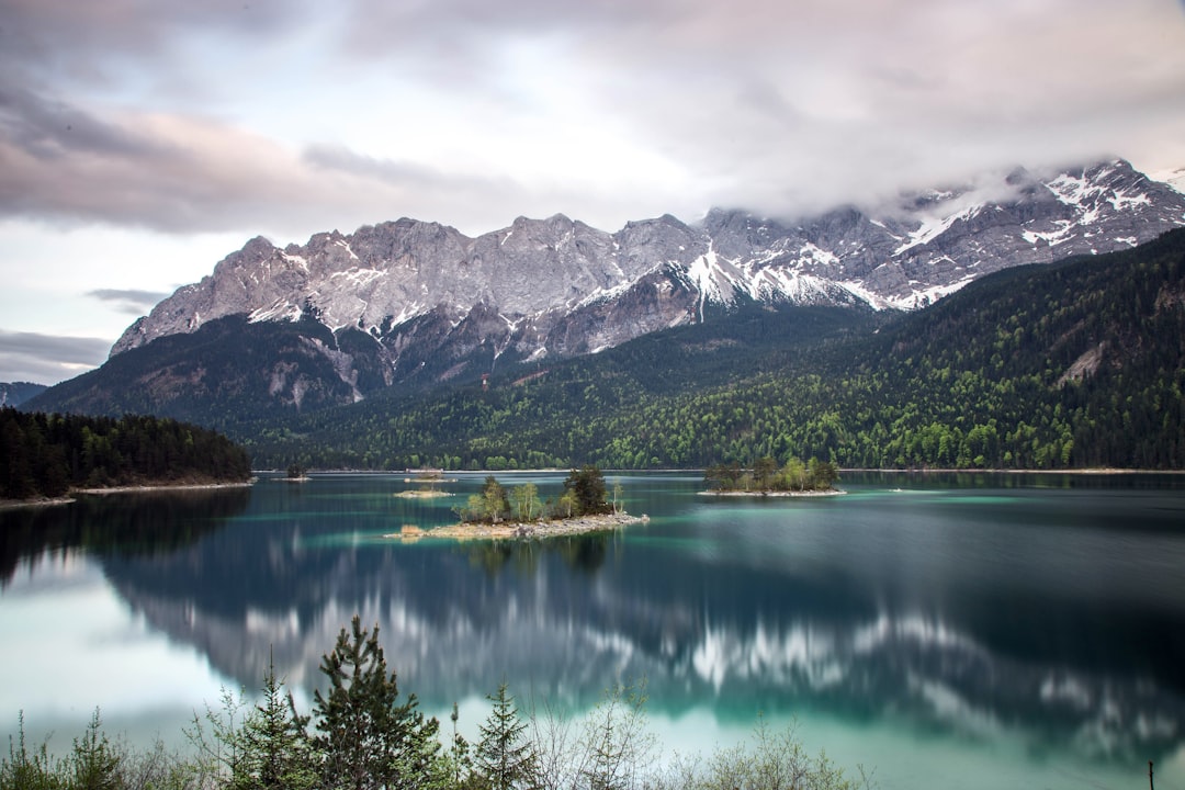 photo of grey mountain across blue lake