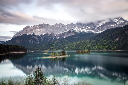 photo of grey mountain across blue lake in Eibsee Germany