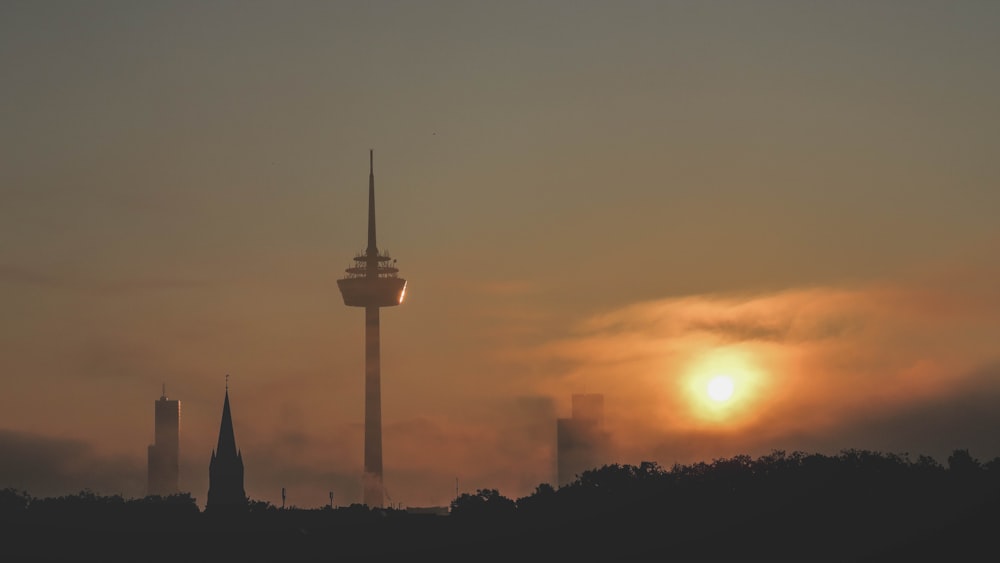 silhouette of tower during sunset