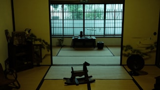 Colorful Japanese ceramics displayed on traditional tatami mats.