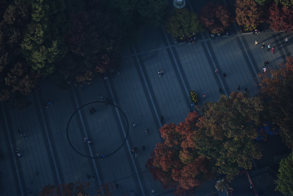 an aerial view of a street with a circle in the middle of it