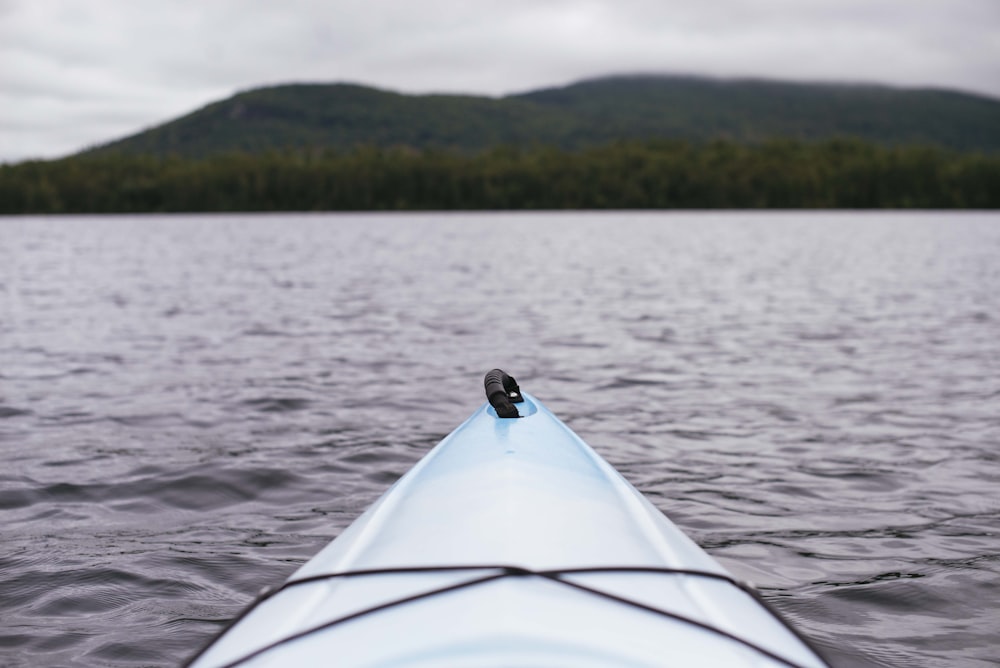 point of view photography of kayak on lake