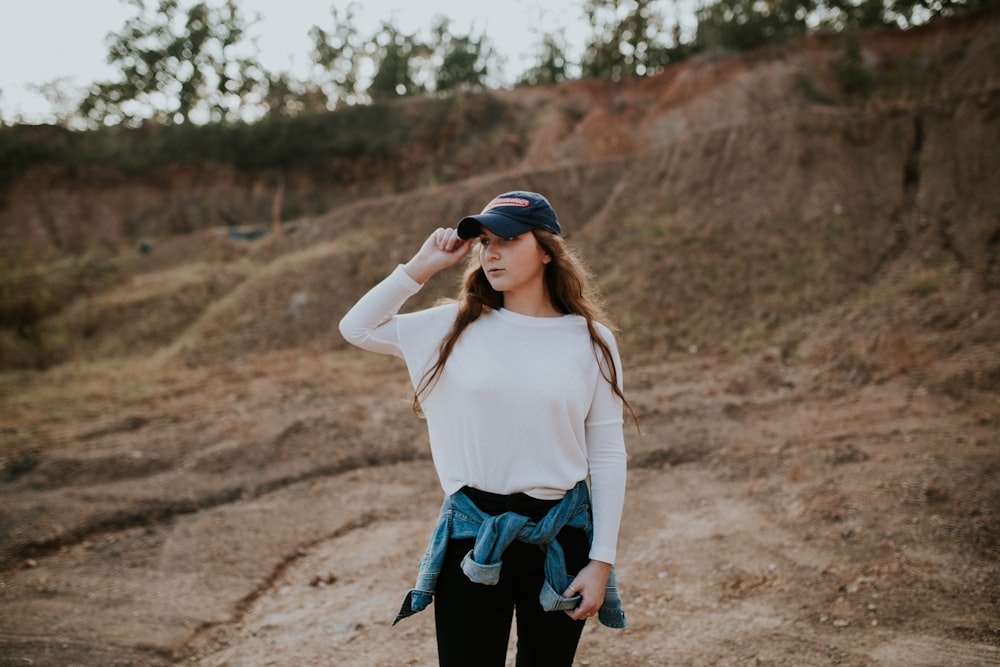 woman wearing white boat-neck long-sleeved shirt