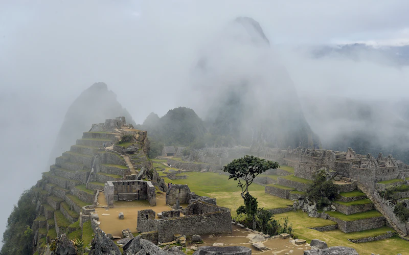 Machu Picchu half-hidden in morning mist