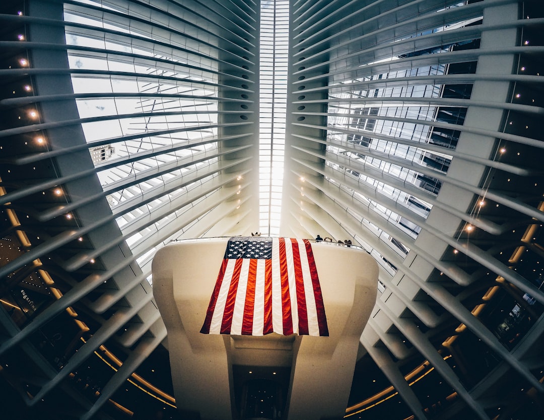 bottom photography of grey metal building and USA flag