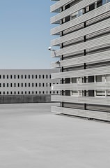 Modern industrial building exterior with clear sky background.