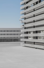 Exterior view of the Romanian industrial building with clear skies highlighting its modern facade.