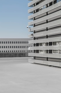 Exterior view of the Romanian industrial building with clear skies highlighting its modern facade.