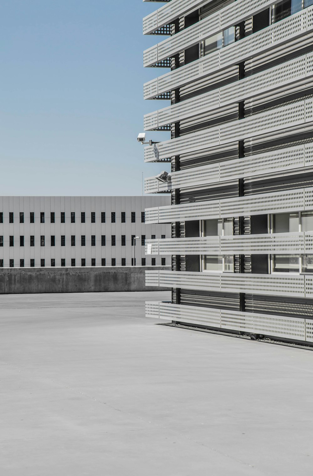 white and gray high-rise building under blue sky at daytime