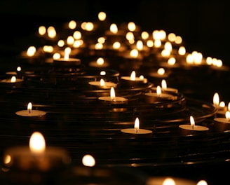 low-angle photo of lightened candles