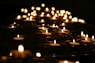 low-angle photo of lightened candles