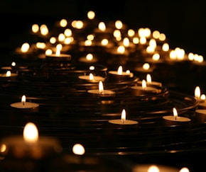 low-angle photo of lightened candles