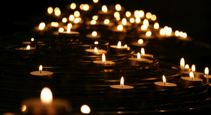 low-angle photo of lightened candles