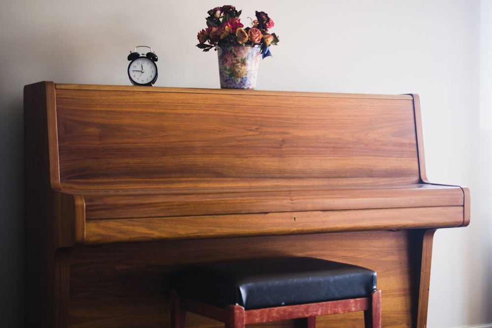 shallow focus photo of brown upright piano