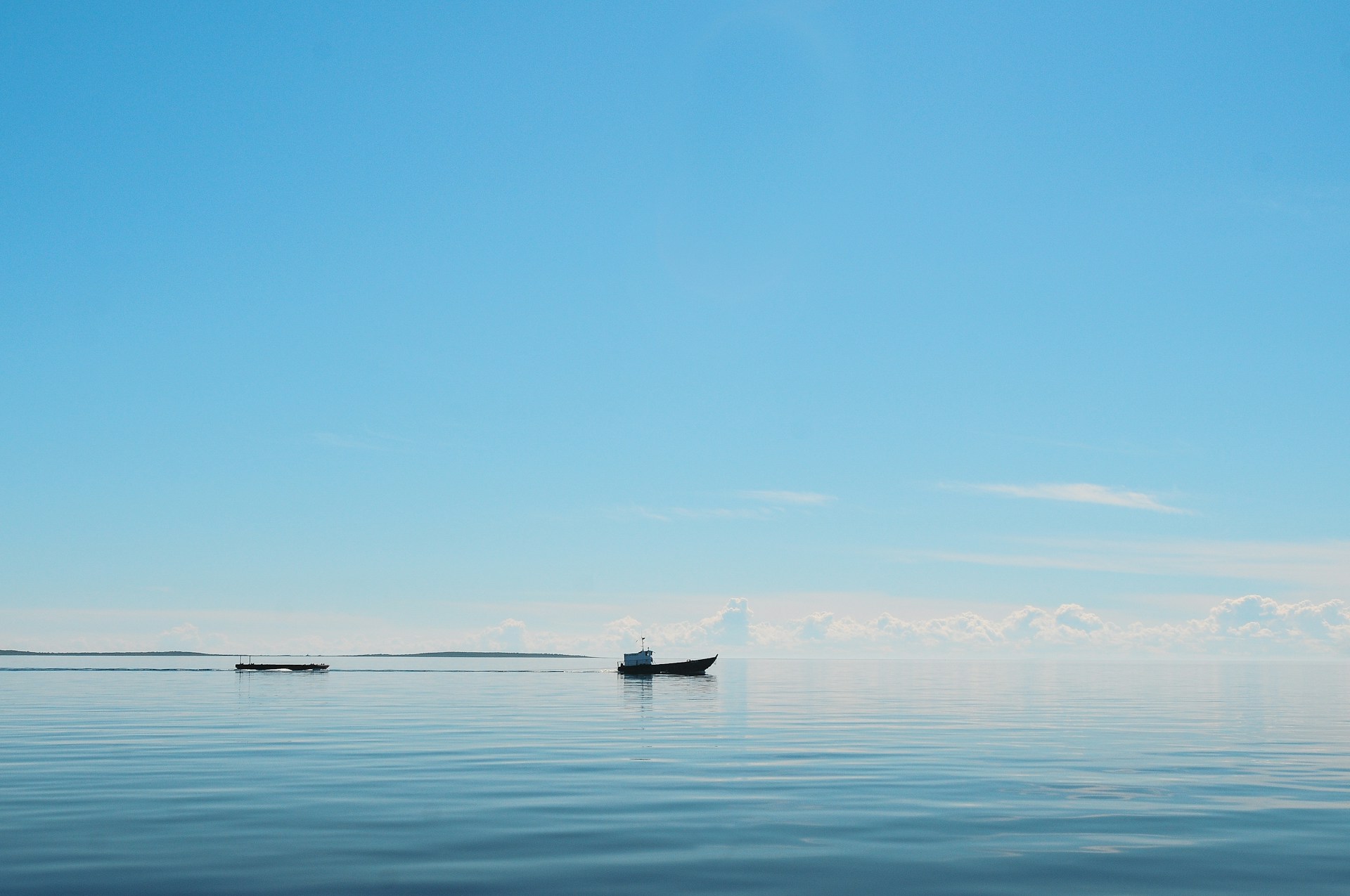 silhouette of boat on the ocean