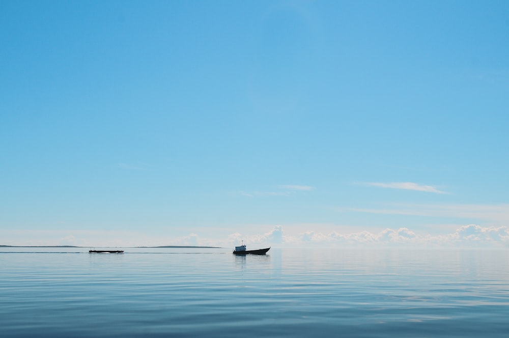 silhouette of boat on the ocean